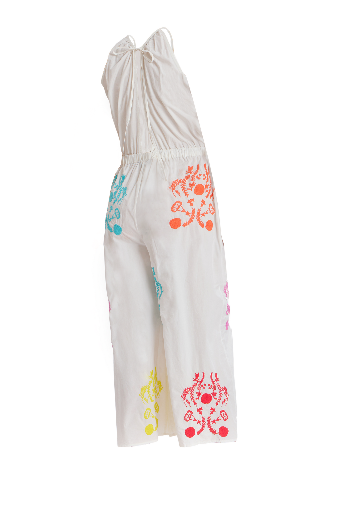 White rainbow embroidered high-neck jumpsuit with colorful motifs, tailored silhouette, and wide-leg pants.